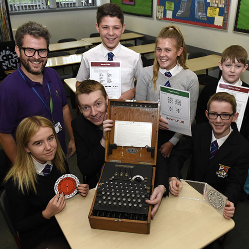 Chris Smith, Strathclyde alumnus and Maths teacher with school pupils Chris Smith, Strathclyde alumnus and Maths teacher with school pupils