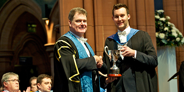 Craig Taylor being presented with the 2014 Strathclyde People Award trophy
