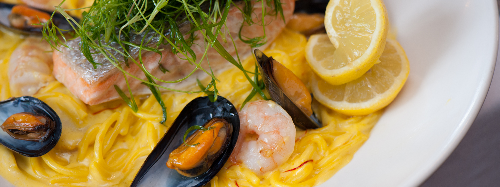 Scottish Salmon with Saffron and Seafood Cream Linguine