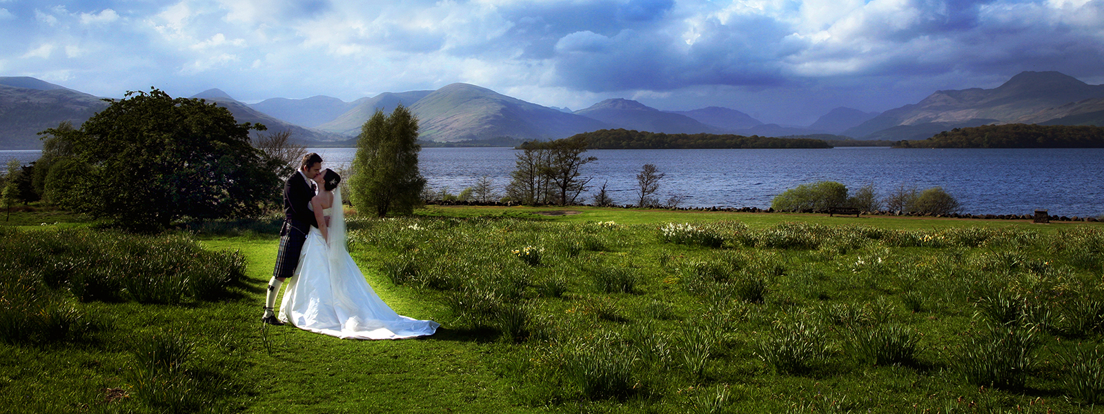 A couple celebrating their marriage in the Ross Priory gardens