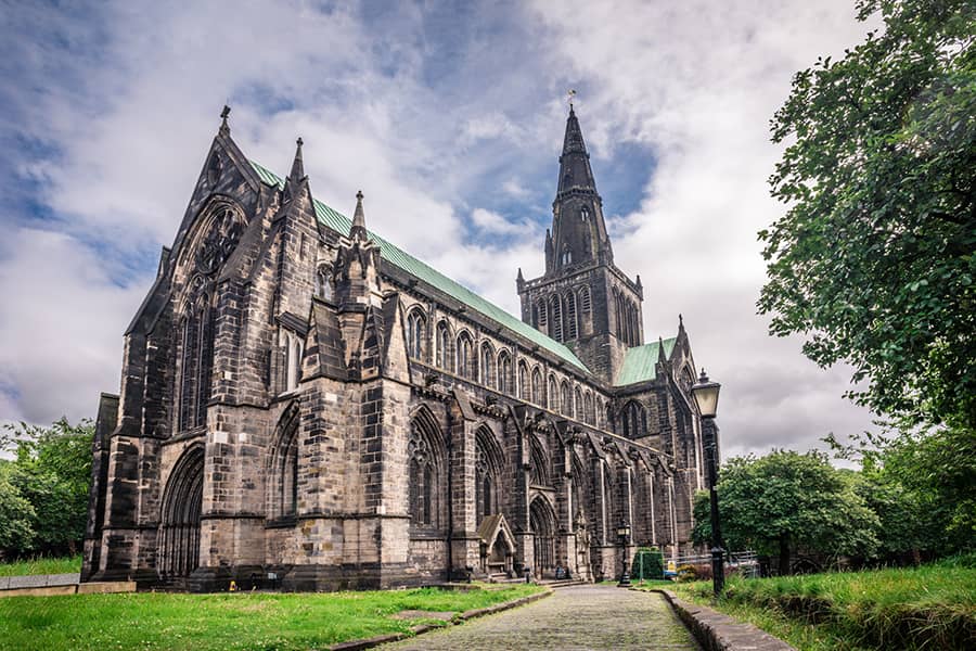 Glasgow Cathedral with a hint of blue sky behind the clouds