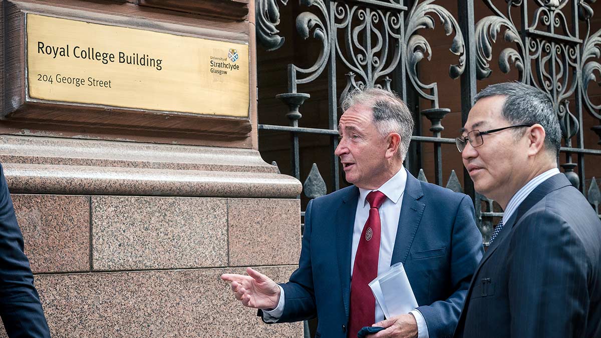 Charles Huang & Professor Sir Jim McDonald outside the Royal College Building.