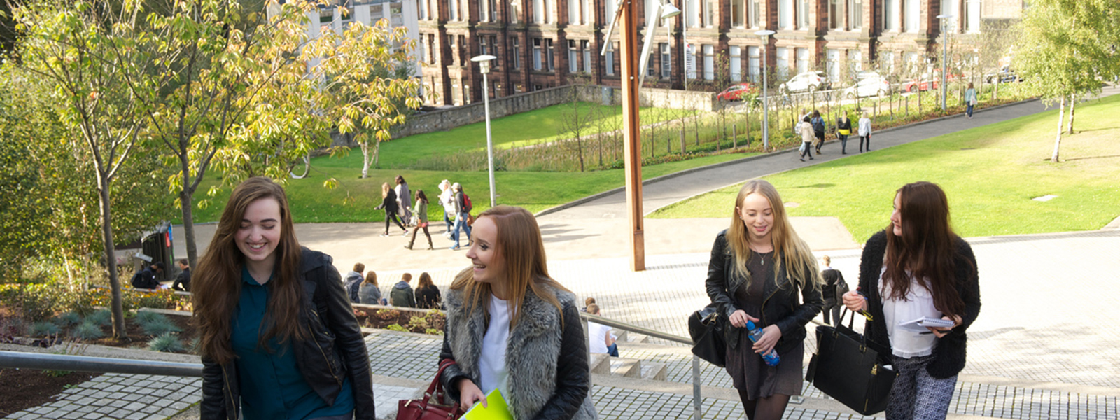 female students climbing stairs at Rottenrow Gardens, University of Strathclyde