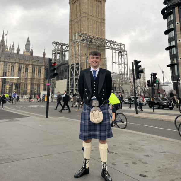 Student standing in front of London tourist landmark