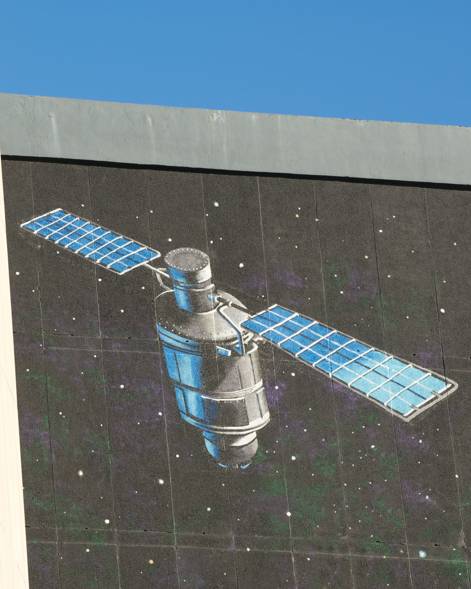 A satellite painted on the top of the graham hills building gable end