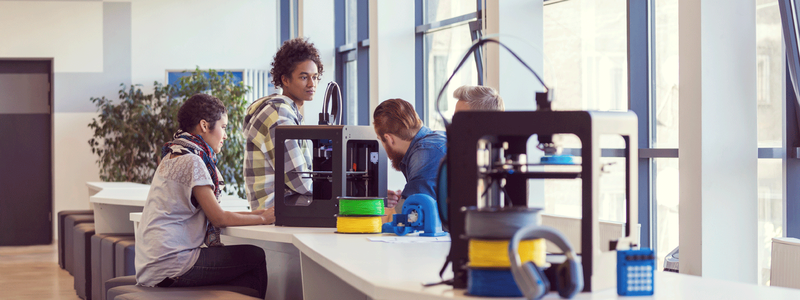 Students work with a 3D printer.