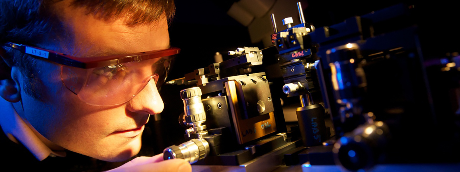 Student setting up a laser rig
