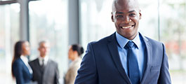 Businessman with colleagues in the background