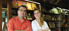 Small business owners standing in their bookshop