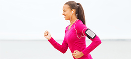 Woman running, listening to music