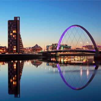 River Clyde and Clyde Arc bridge in Glasgow at dusk.
