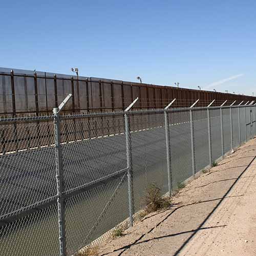 Three lines of border fence