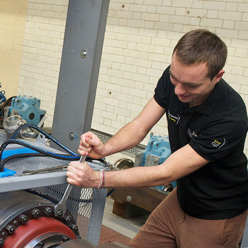 Mechanical & Aerospace Engineering students and researchers work with a turbine.