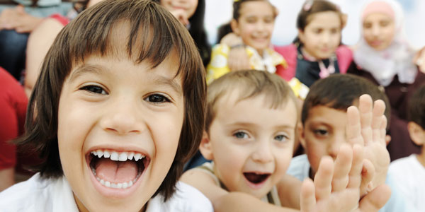 children smiling at the camera