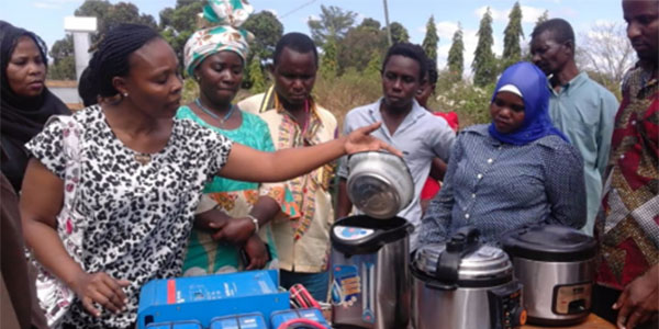 People using cooking utensils in Malawi