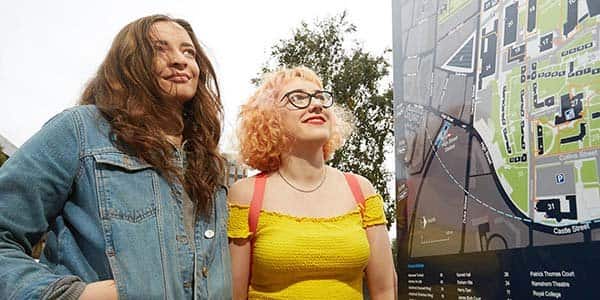 Two students looking at campus map in Open Day