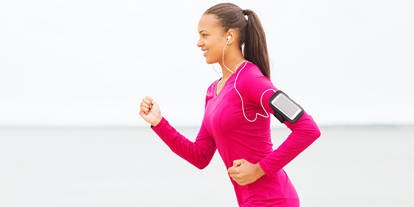 Woman running, listening to music