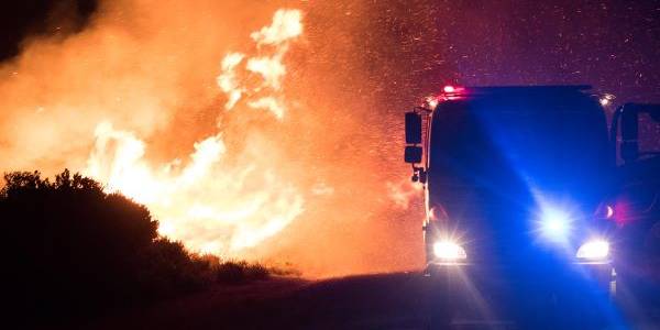 A lorry driving away from fire. Picture courtesy of Warren Frey, Tasmania Fire Service