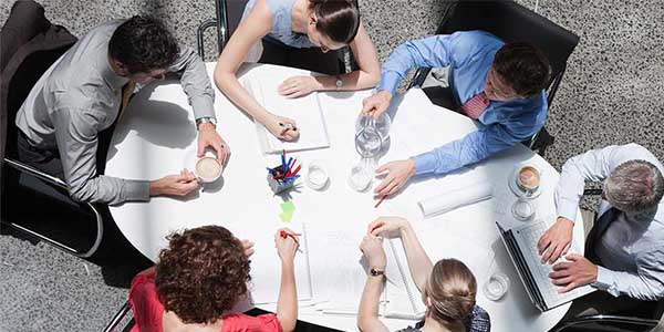 Aerial view of a business meeting between six people