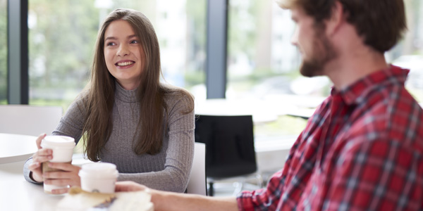 Two people enjoying a coffee and a chat