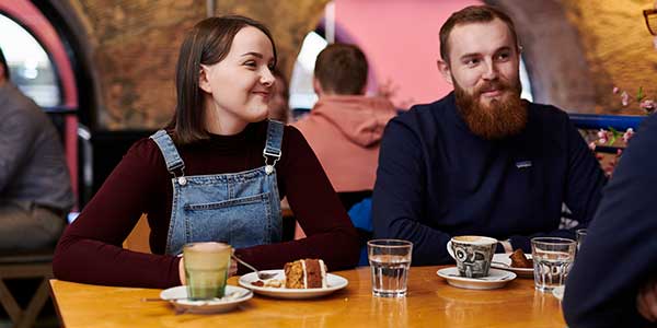 People drinking coffee in a cafe.