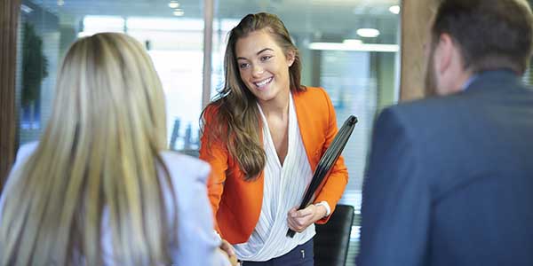 Person walking into an interview room.