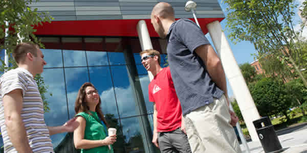 Students standing chatting outside