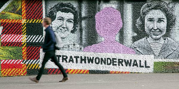 Student walking past the Strathclyde Wonderwall