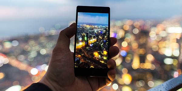 Person taking a photo with a mobile phone