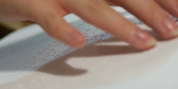 A person reading braille