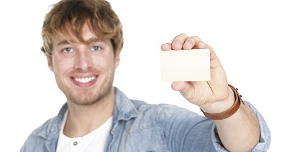 A student holding a blank student card