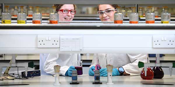 Two students in science lab.