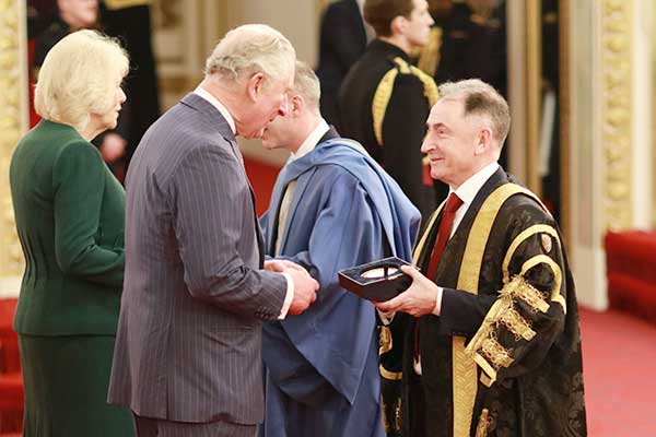 Professor Sir Jim McDonald and Professor Stephen McArthur receive the Queen's Anniversary Prizes award.