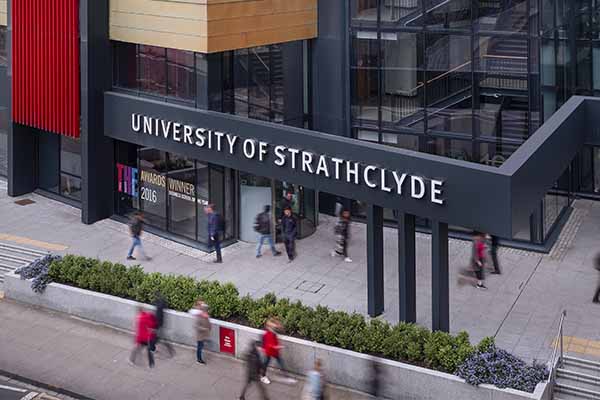 Exterior of Strathclyde Business School with people walking by