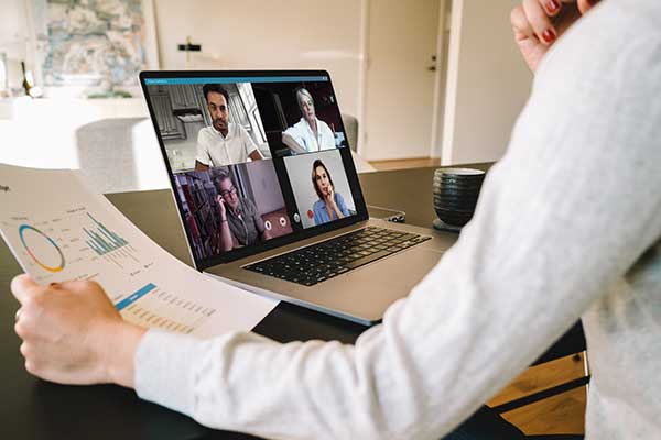 Person on a conference call on their laptop.