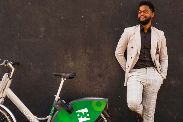 Person standing next to an OVO Bike.