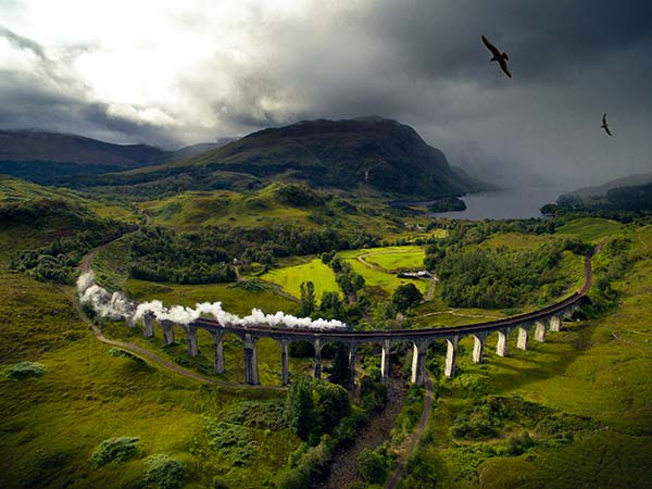 The Jacobite Stream Train crossing Glenfinnan Viaduct.