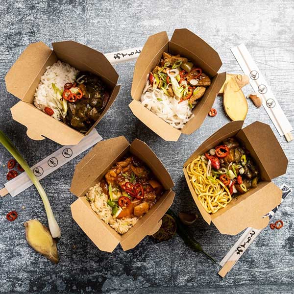 Aerial view of takeaway meals in carboard container.