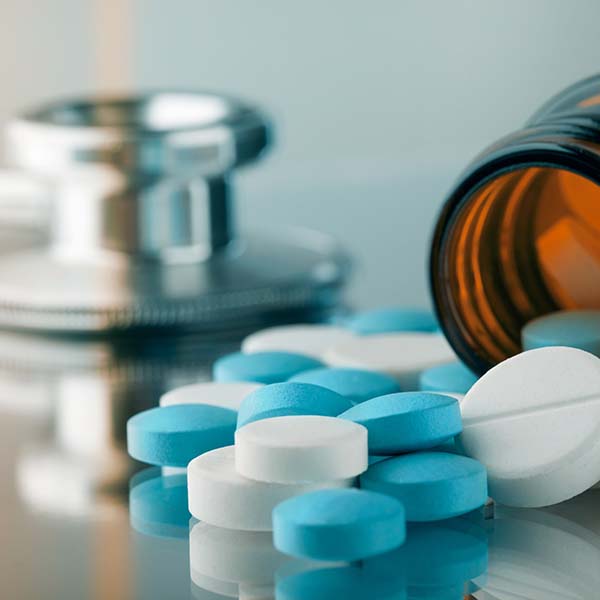 Medicine bottle with pills on the table