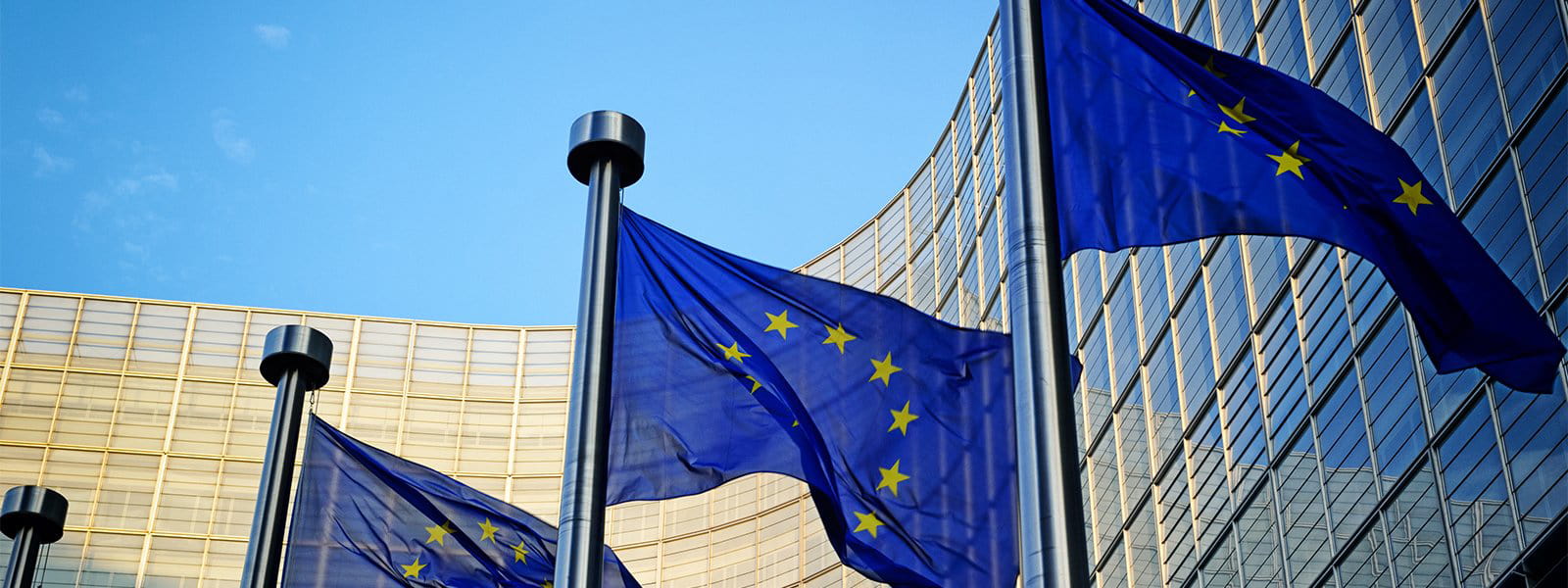 EU flags in front of European Commission in Brussels