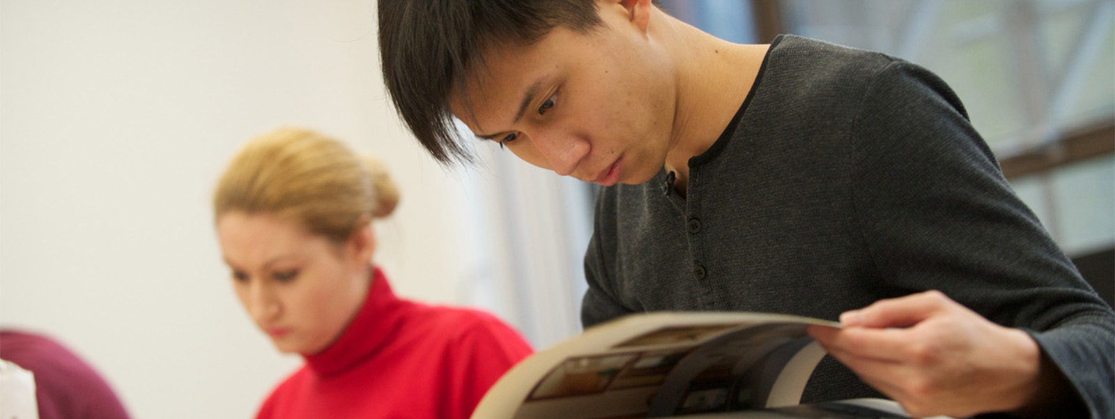 Students looking at books