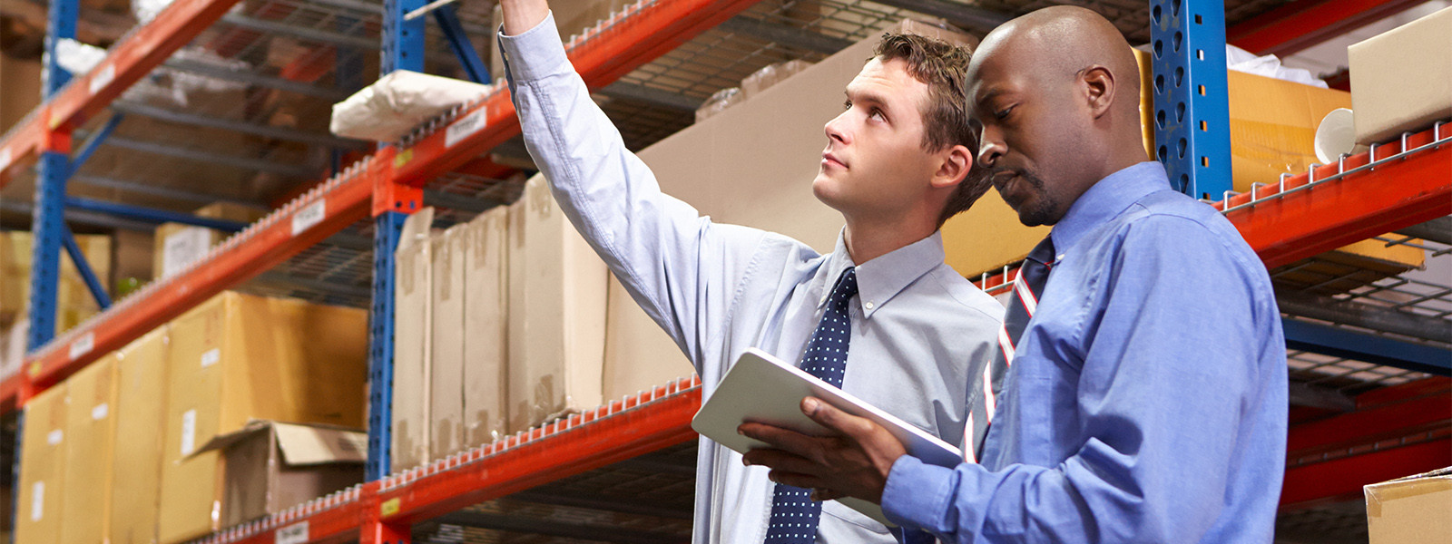 Two business men in a warehouse