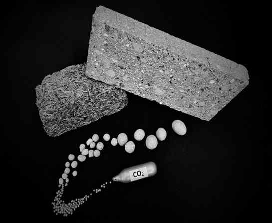 Insulation materials including a bale of hay alongside a bottle marked CO2 Insulation materials including a bale of hay alongside a bottle marked CO2