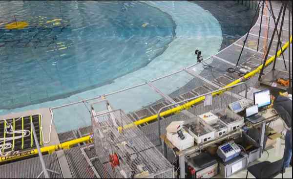 Scientific equipment around a circular pool of water