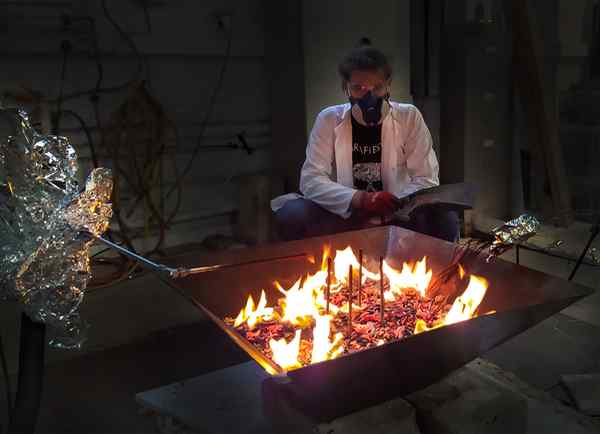 People sitting by a fire