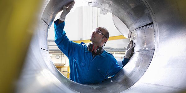 Engineer works with turbines.