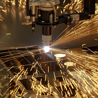 Plasma cutting metalwork industry machine with sparks.