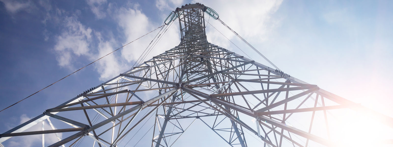 energy pylon against a blue sky