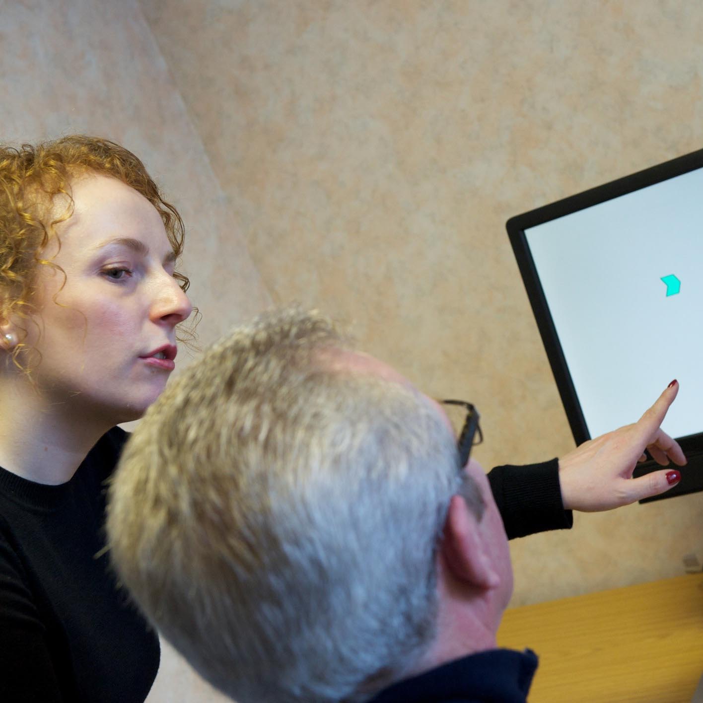 Researcher working with patient.