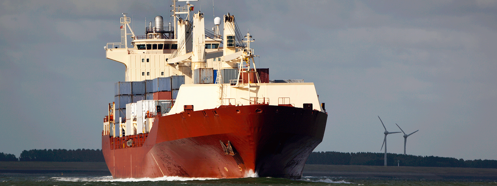 Red hull of a bulk cargo ship.